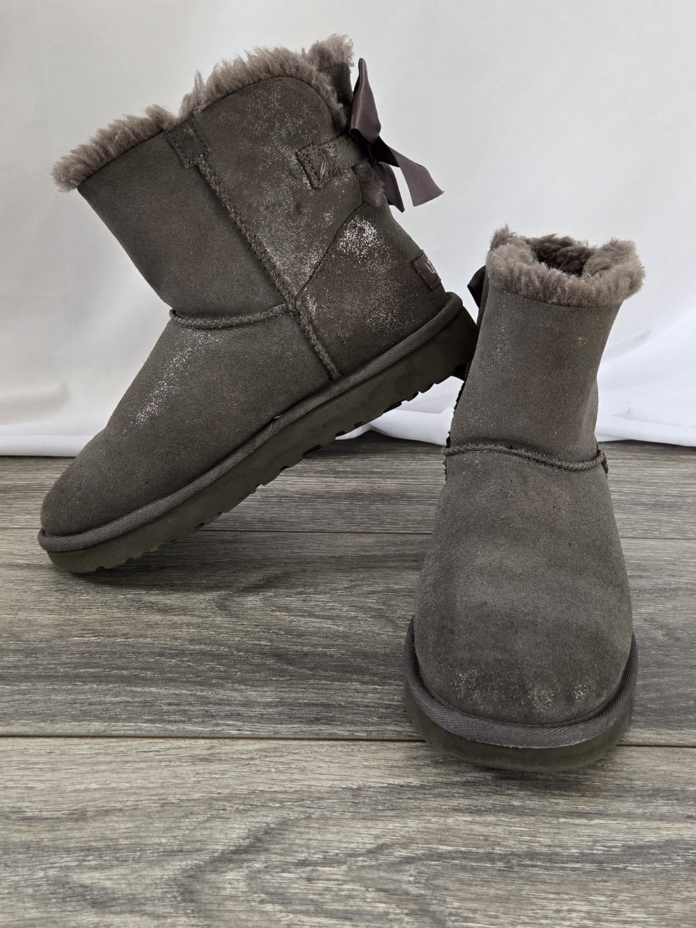 UGG Mini Bailey Bow Boots in Shimmer Gray - Size 7